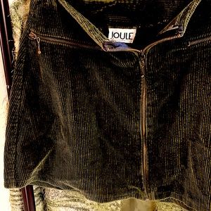 Women’s corduroy green zip up skirt with 2 zipper pockets.
